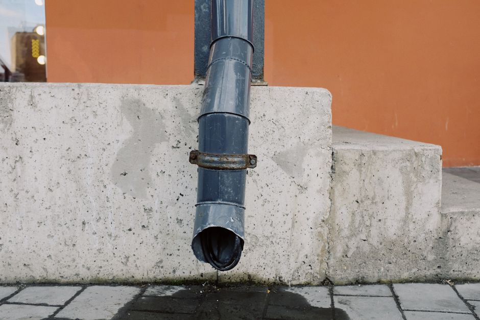 A downspout directing water away from a home near the water in Suamico, Wisconsin