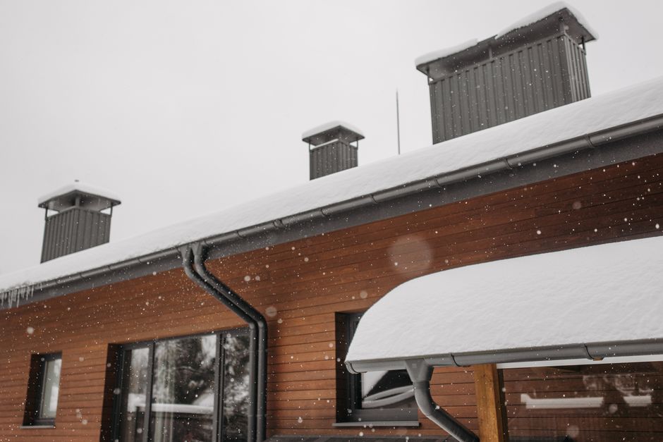 Reverse-curve gutter guard installed along a residential roofline